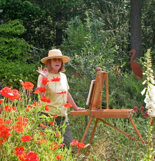 Justina Selinger painting "en Plein Air" in her garden