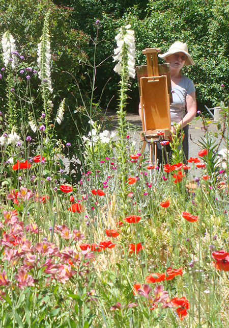 Justina painting in her garden, an official Certified Wildlife Habitat