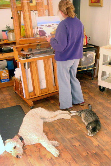 Justina Selinger painting in her studio