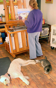 Justina in her painting studio, with friends.